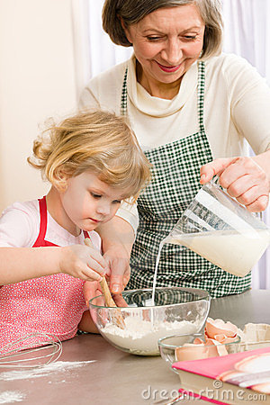 grandmother-granddaughter-baking-cookies-23639875
